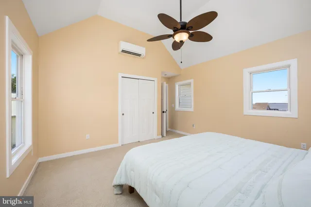 a bedroom with a bed and a tv