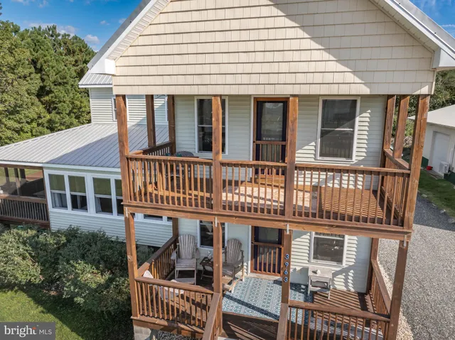 an aerial view of a house with outdoor space