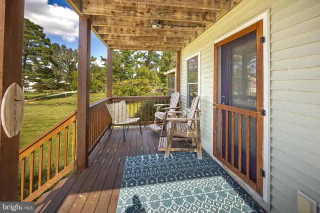 a view of a balcony with chairs