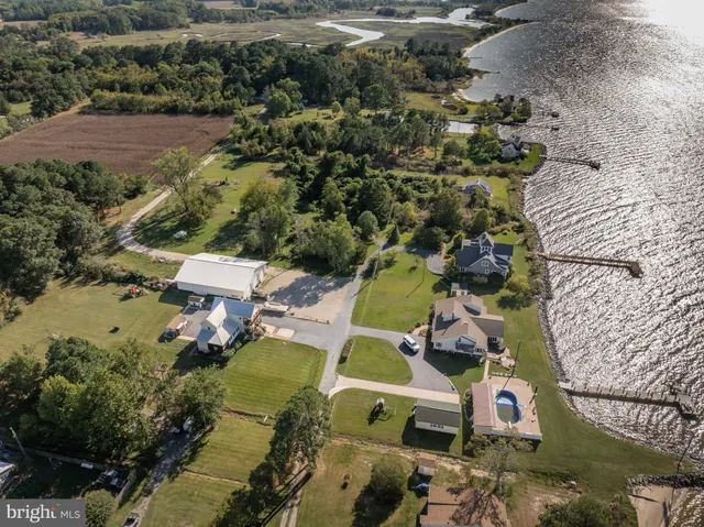 a front view of house with yard and swimming pool