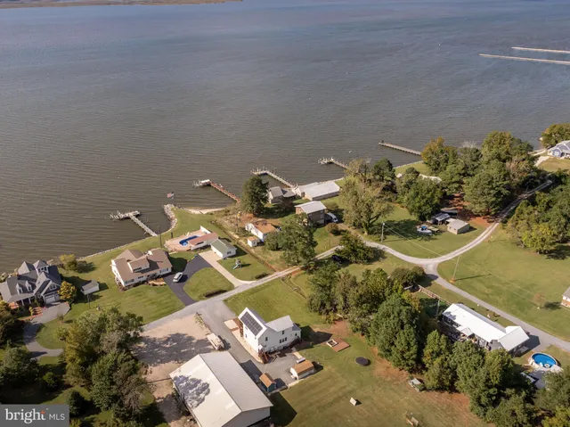 an aerial view of a house with yard swimming pool and outdoor seating