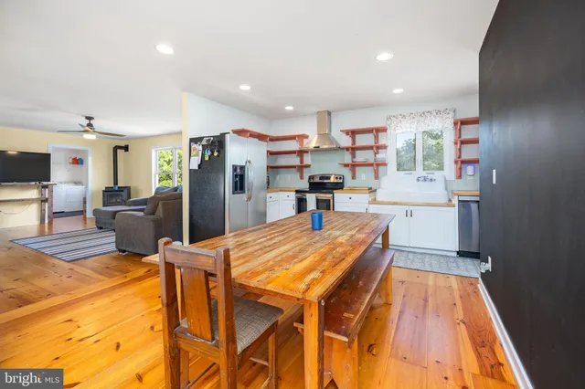 a kitchen with stainless steel appliances granite countertop a sink and a cabinets