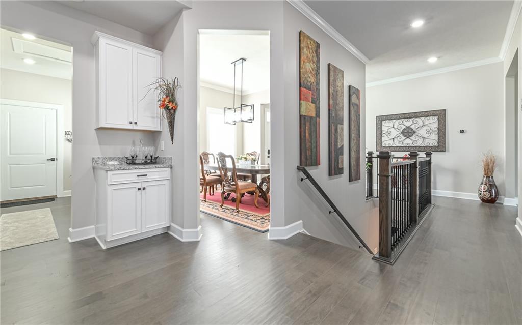 3044 Spruce Road Gibsonia, PA 15044 - Photo 3 of 25 a view of a hallway with workspace and wooden floor