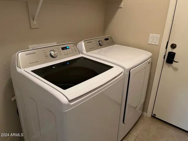 a close up view of washer and dryer with washer