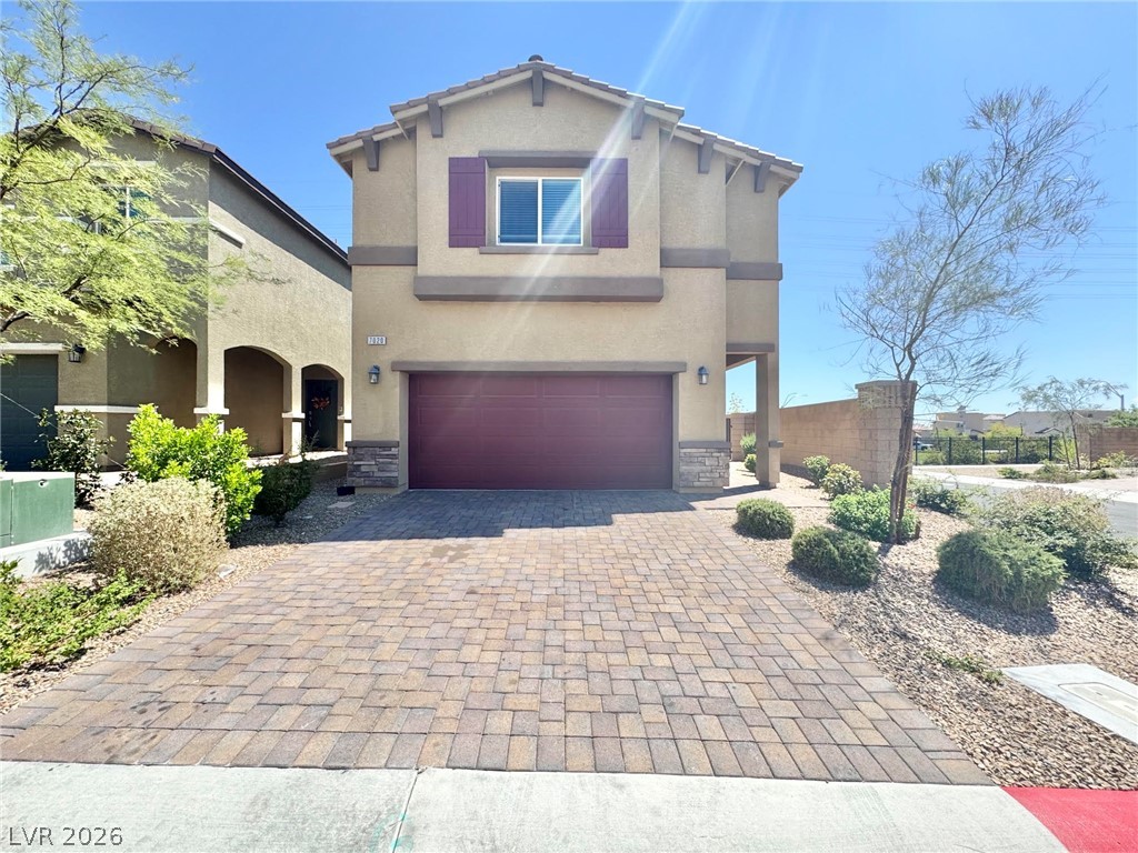 7020 Colonial Ranch Street Las Vegas, NV 89166 - Photo 1 of 37 A spacious brick paver driveway leads to this two-story stucco exterior with stone accents.