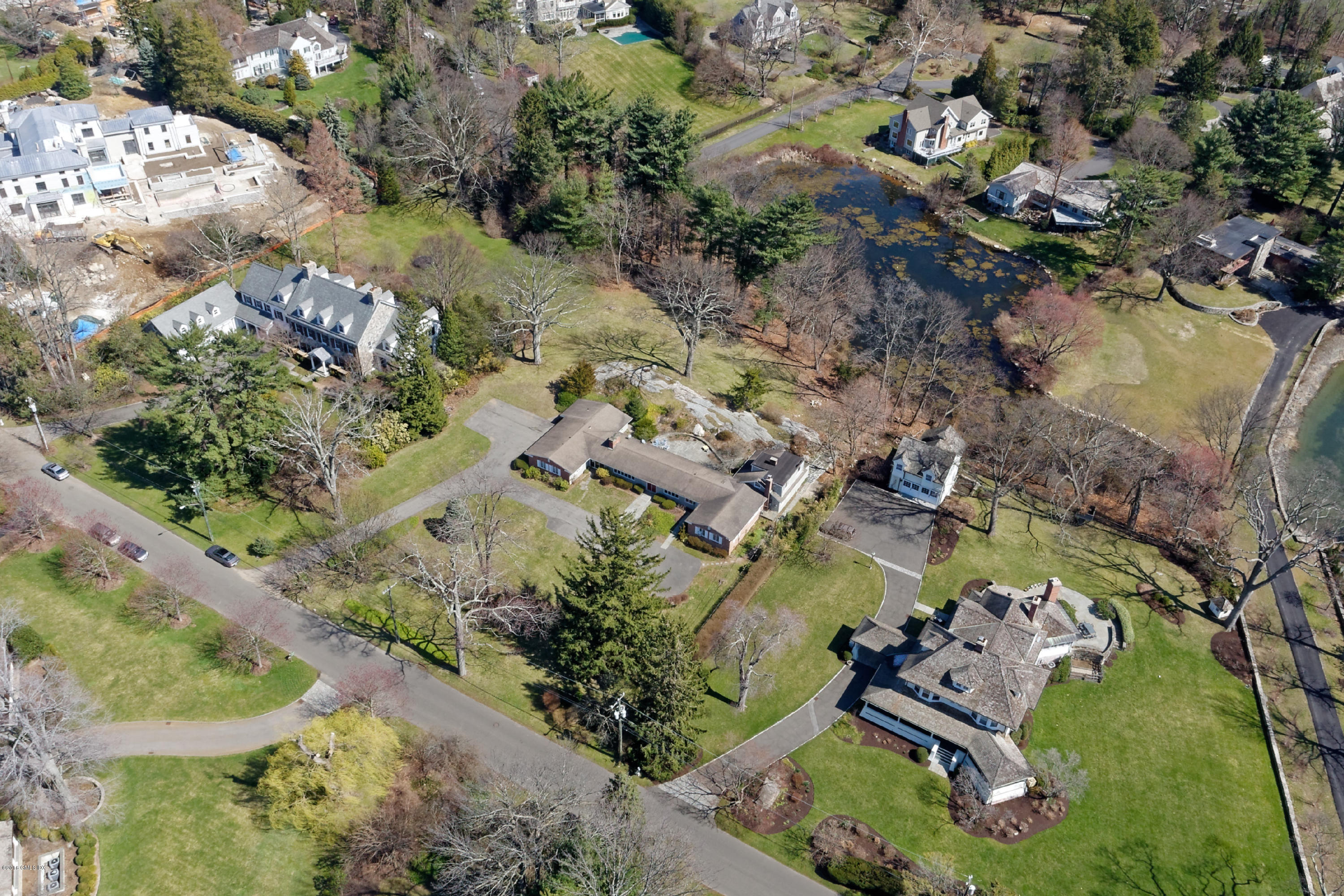 90 Club Road Riverside, CT 06878 - Photo 5 of 20 an aerial view of a house with a yard and lake view