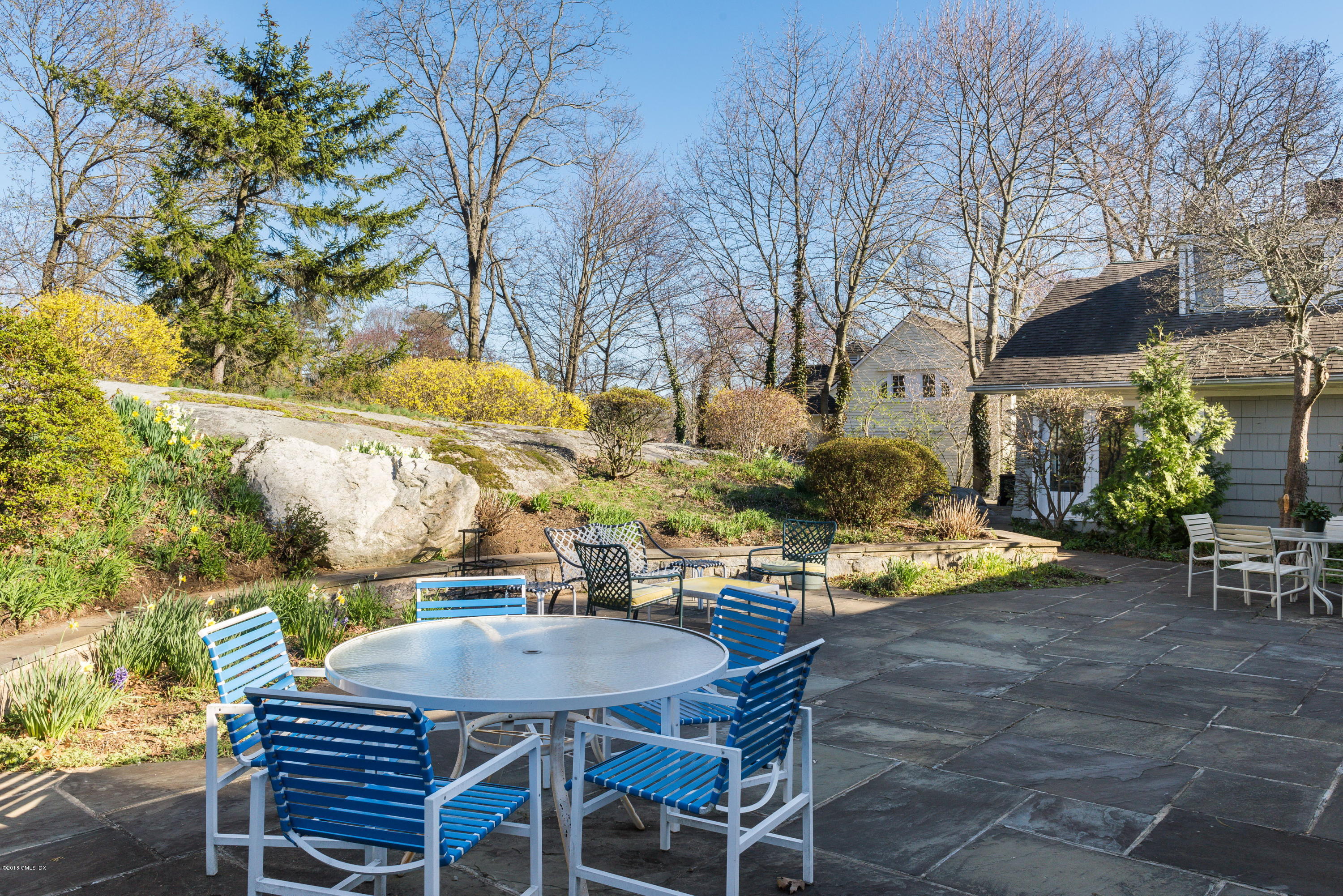 90 Club Road Riverside, CT 06878 - Photo 6 of 20 a view of an outdoor space with dining table and chairs