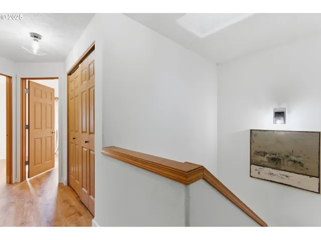 a view of room with hardwood floor and cabinet