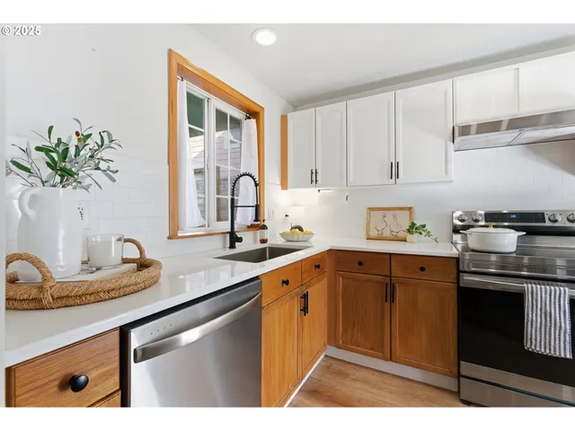 a kitchen with a sink stove and cabinets