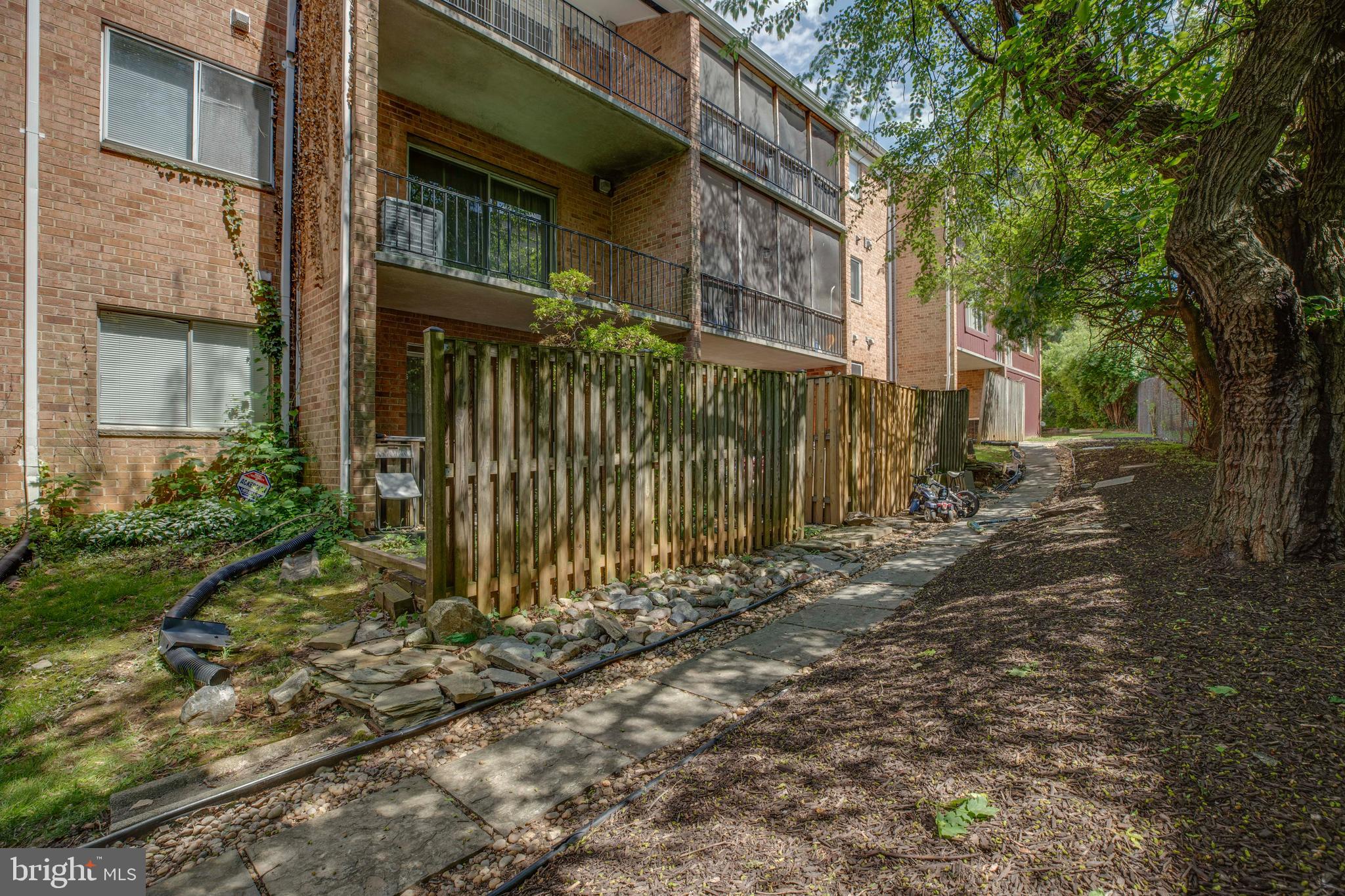 3382 Hewitt Avenue, Unit 102 Silver Spring, MD 20906 - Photo 18 of 22 a view of a brick house with many windows