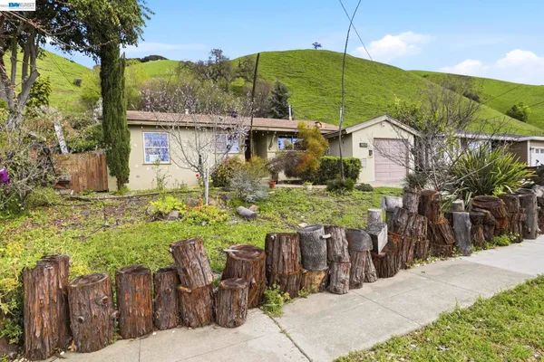 a view of a chairs and table in the patio