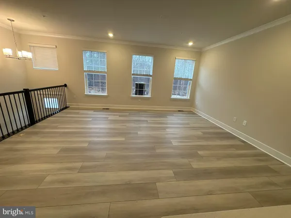 a view of balcony with wooden floor