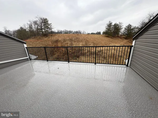 an empty room with projector and screen