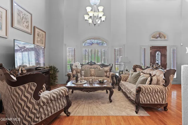 a living room with furniture or chandelier and a couch