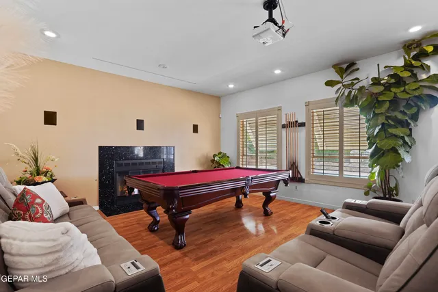 a living room with furniture a window and a chandelier