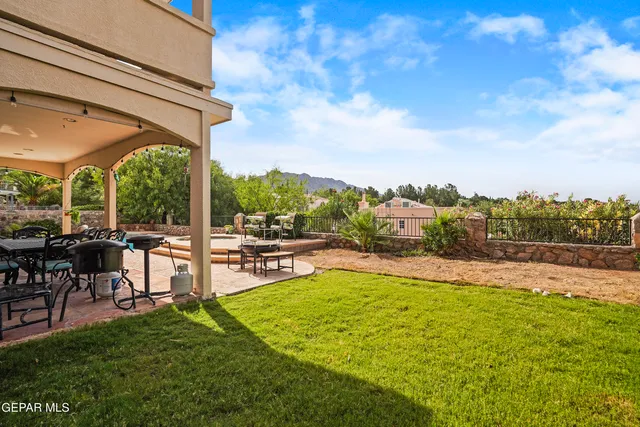 a view of swimming pool and outdoor seating