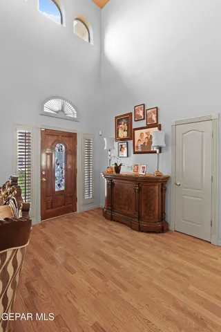 a room with a bed and dresser