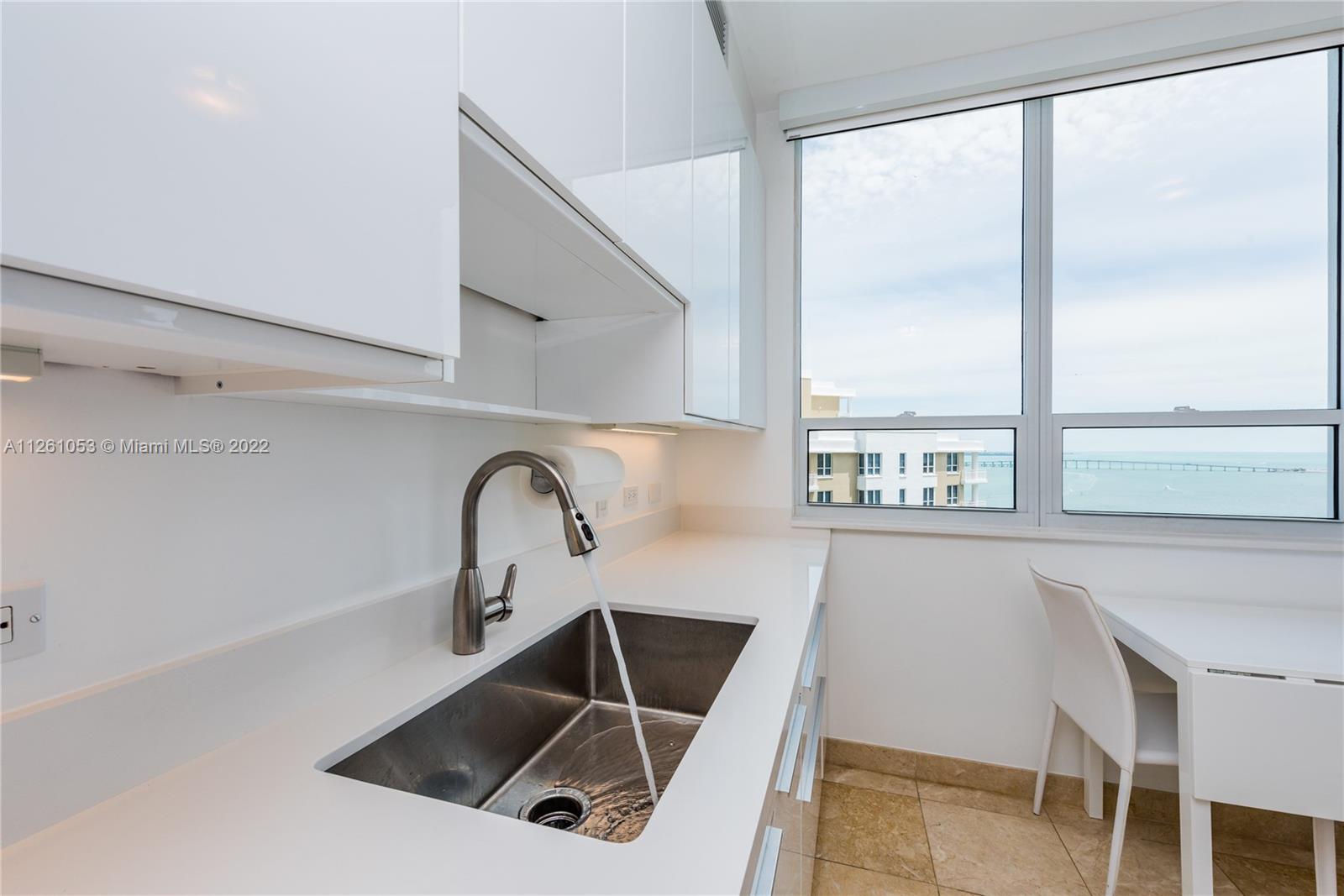 801 Brickell Key Boulevard, Unit 2401 Miami, FL 33131 - Photo 12 of 35 a sink with a window