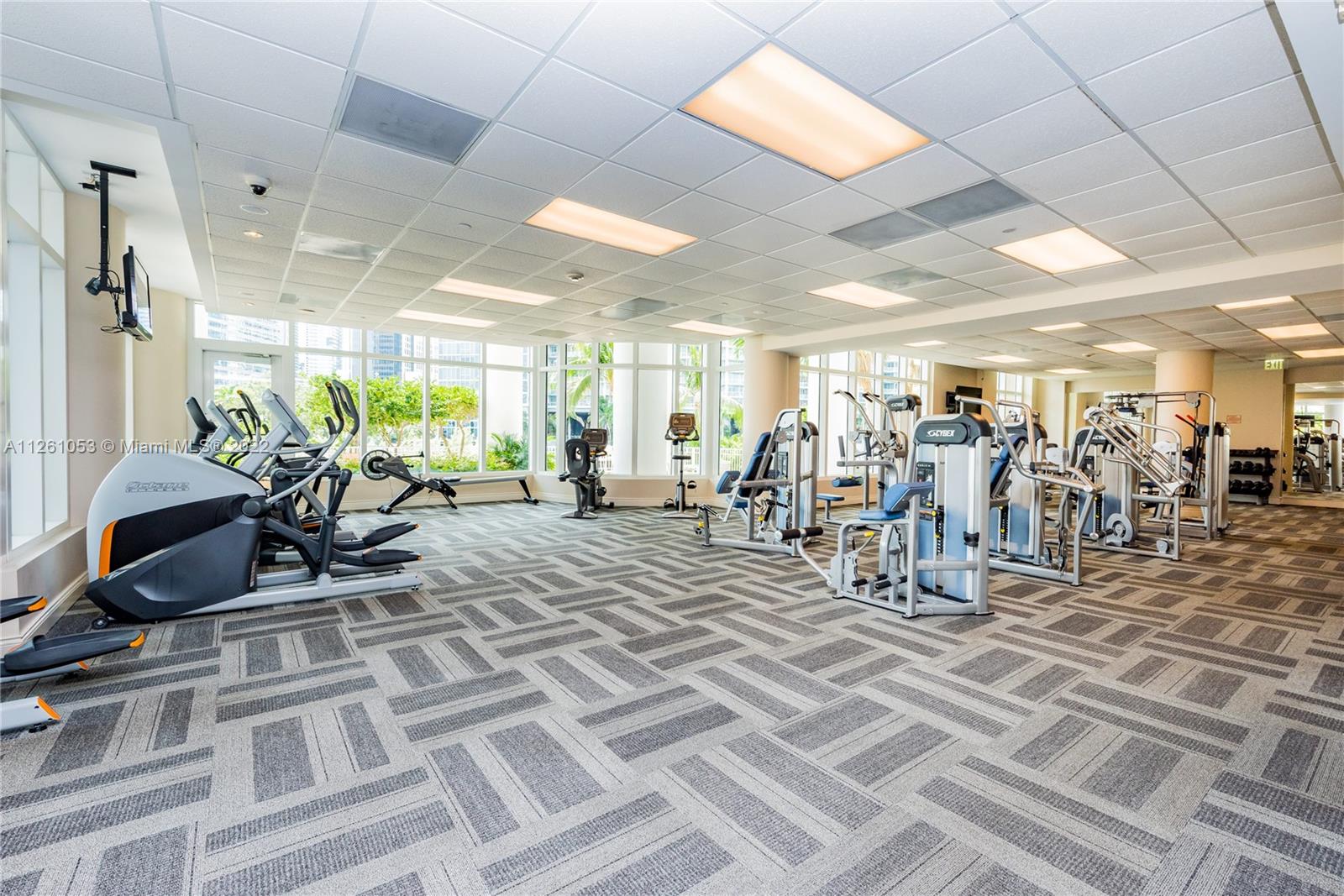 801 Brickell Key Boulevard, Unit 2401 Miami, FL 33131 - Photo 29 of 35 a view of a room with gym equipment
