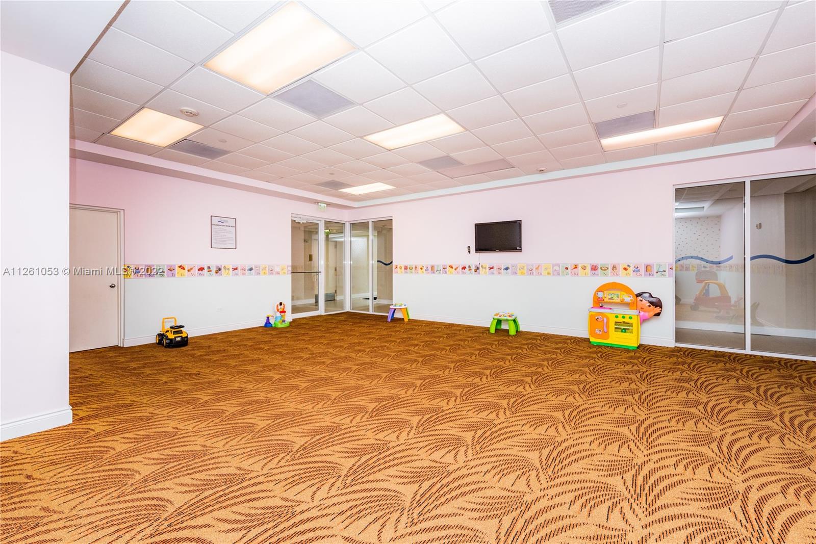 801 Brickell Key Boulevard, Unit 2401 Miami, FL 33131 - Photo 31 of 35 a bedroom with a bed and a couch