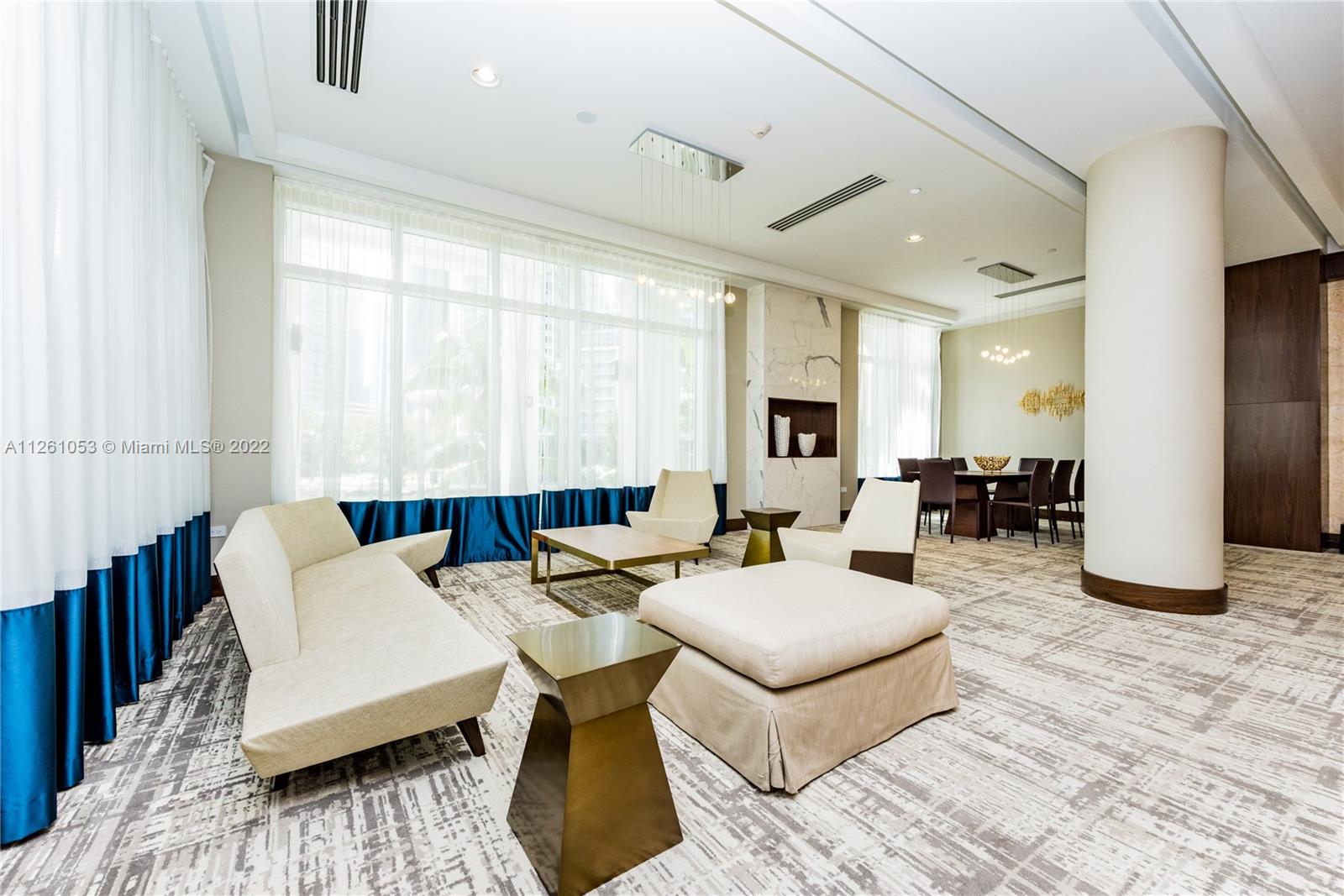 801 Brickell Key Boulevard, Unit 2401 Miami, FL 33131 - Photo 32 of 35 a living room with furniture and wooden floor