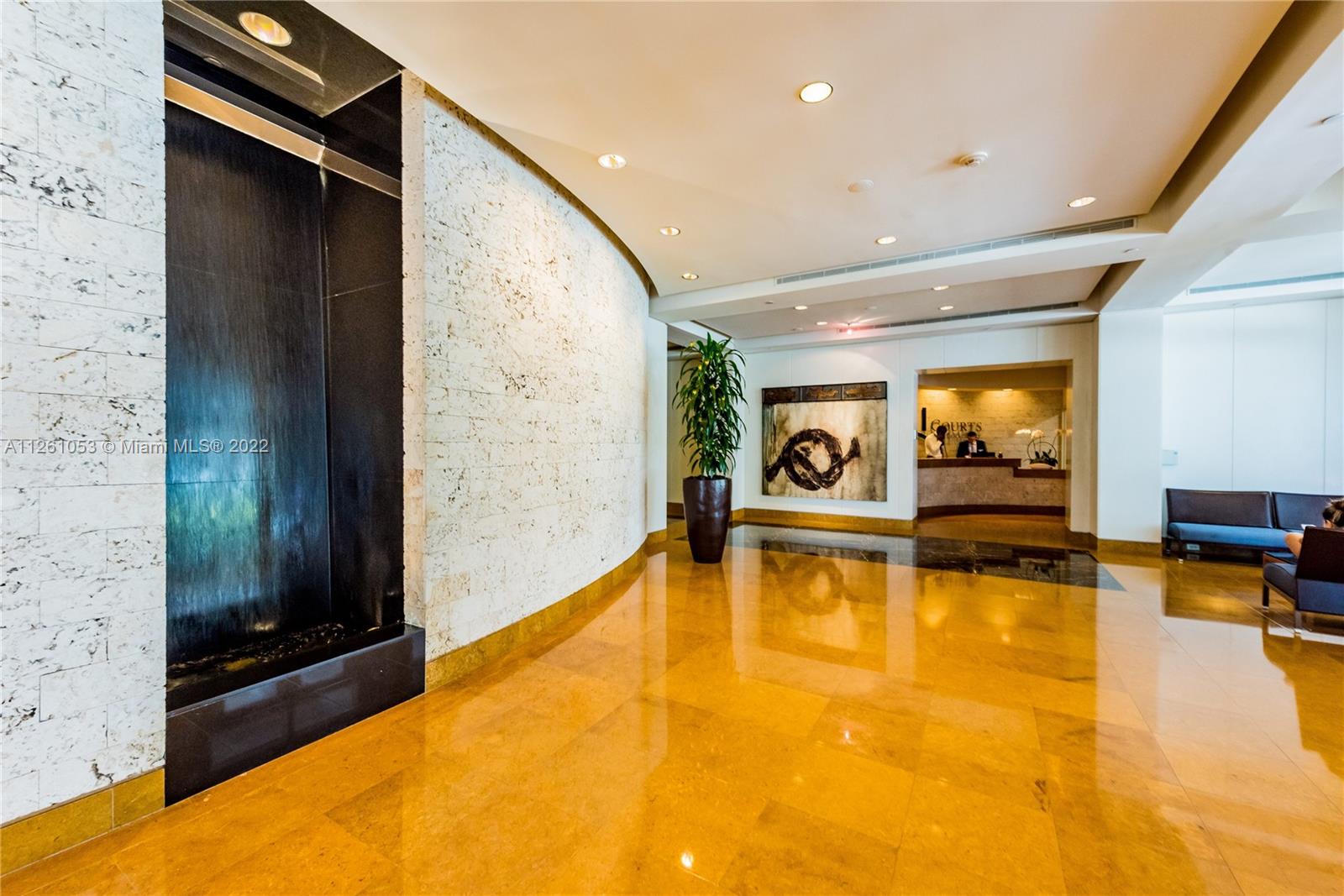 801 Brickell Key Boulevard, Unit 2401 Miami, FL 33131 - Photo 34 of 35 a view of a swimming pool with seating area