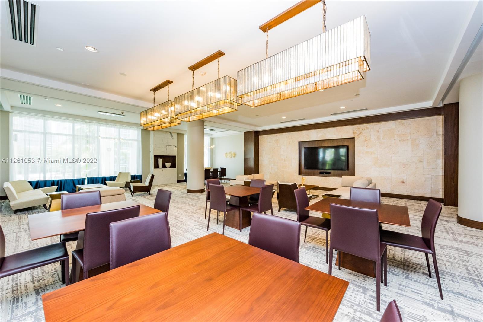 801 Brickell Key Boulevard, Unit 2401 Miami, FL 33131 - Photo 35 of 35 a living room with furniture a rug and a window