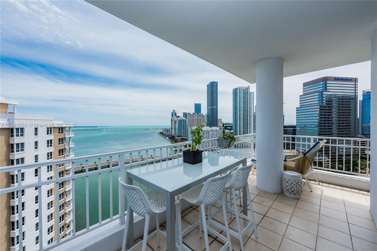 801 Brickell Key Boulevard, Unit 2401 Miami, FL 33131 - Photo 9 of 35 a view of a terrace with furniture and window