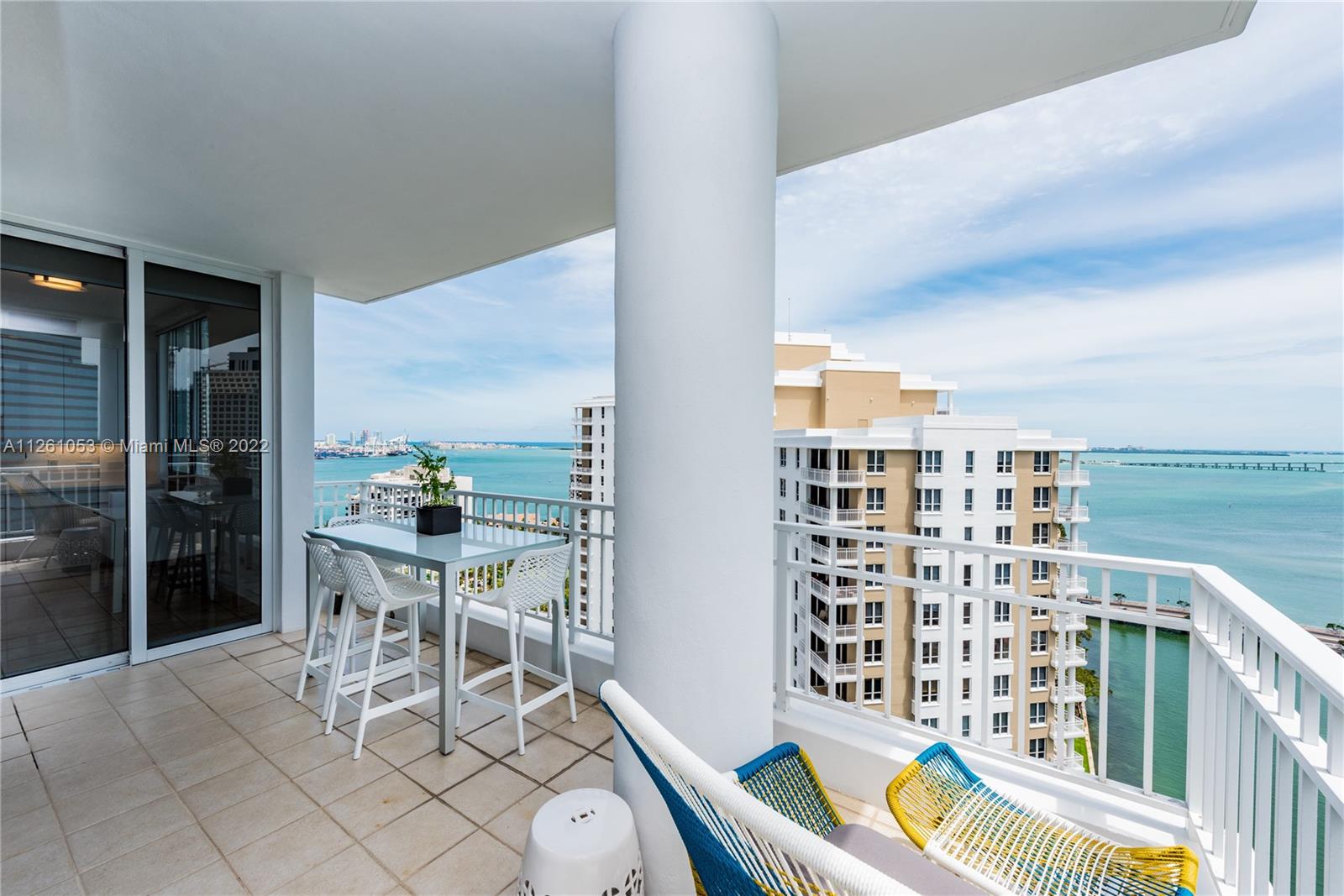 801 Brickell Key Boulevard, Unit 2401 Miami, FL 33131 - Photo 10 of 35 a balcony with a couch and chairs