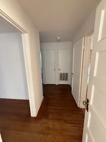 a view of entryway with wooden floor