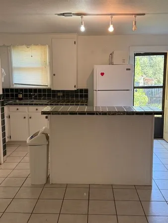 a view of a refrigerator and window