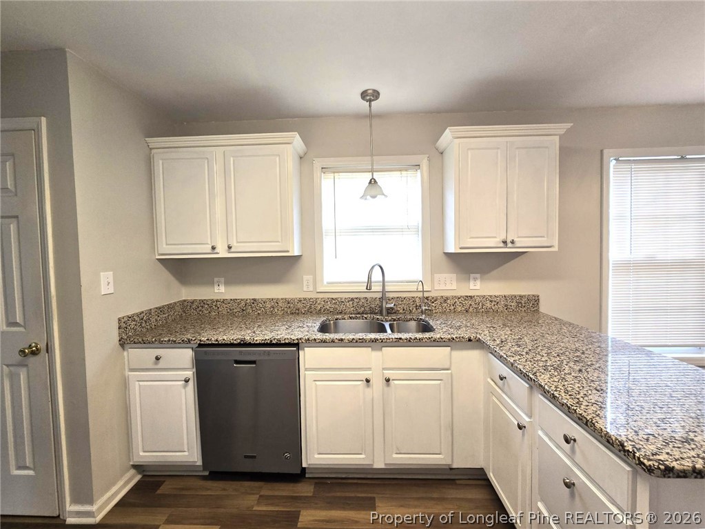 5527 Rising Ridge Drive Hope Mills, NC 28348 - Photo 13 of 35 a kitchen with a sink stove and cabinets