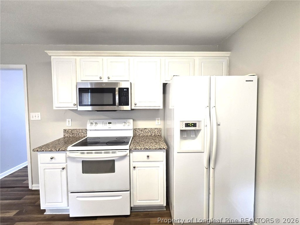 5527 Rising Ridge Drive Hope Mills, NC 28348 - Photo 14 of 35 a white refrigerator freezer sitting inside of a kitchen