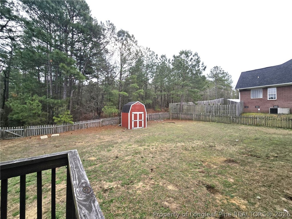5527 Rising Ridge Drive Hope Mills, NC 28348 - Photo 21 of 35 a view of a wooden fence next to a yard
