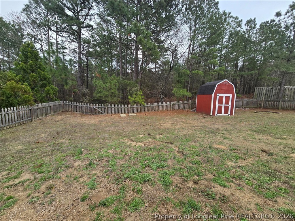 5527 Rising Ridge Drive Hope Mills, NC 28348 - Photo 23 of 35 a view of a yard with large trees