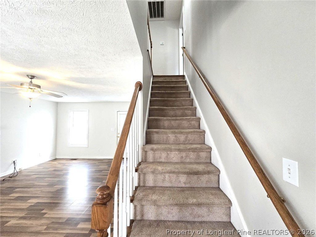 5527 Rising Ridge Drive Hope Mills, NC 28348 - Photo 24 of 35 a view of entryway and hall with wooden floor