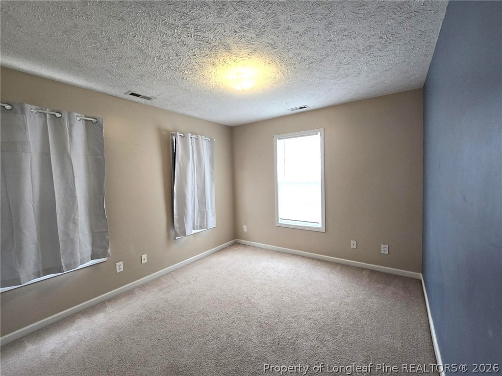 5527 Rising Ridge Drive Hope Mills, NC 28348 - Photo 34 of 35 an empty room with windows