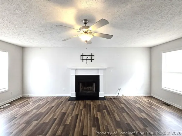 a bedroom with a bed and a fireplace