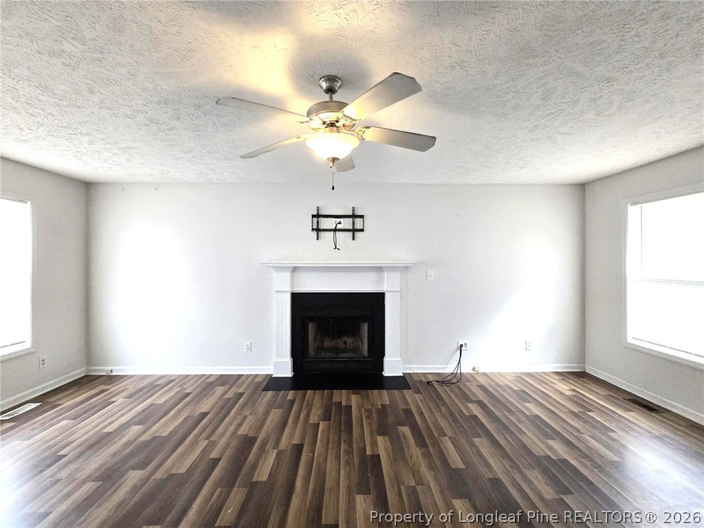 5527 Rising Ridge Drive Hope Mills, NC 28348 - Photo 7 of 35 a bedroom with a bed and a fireplace