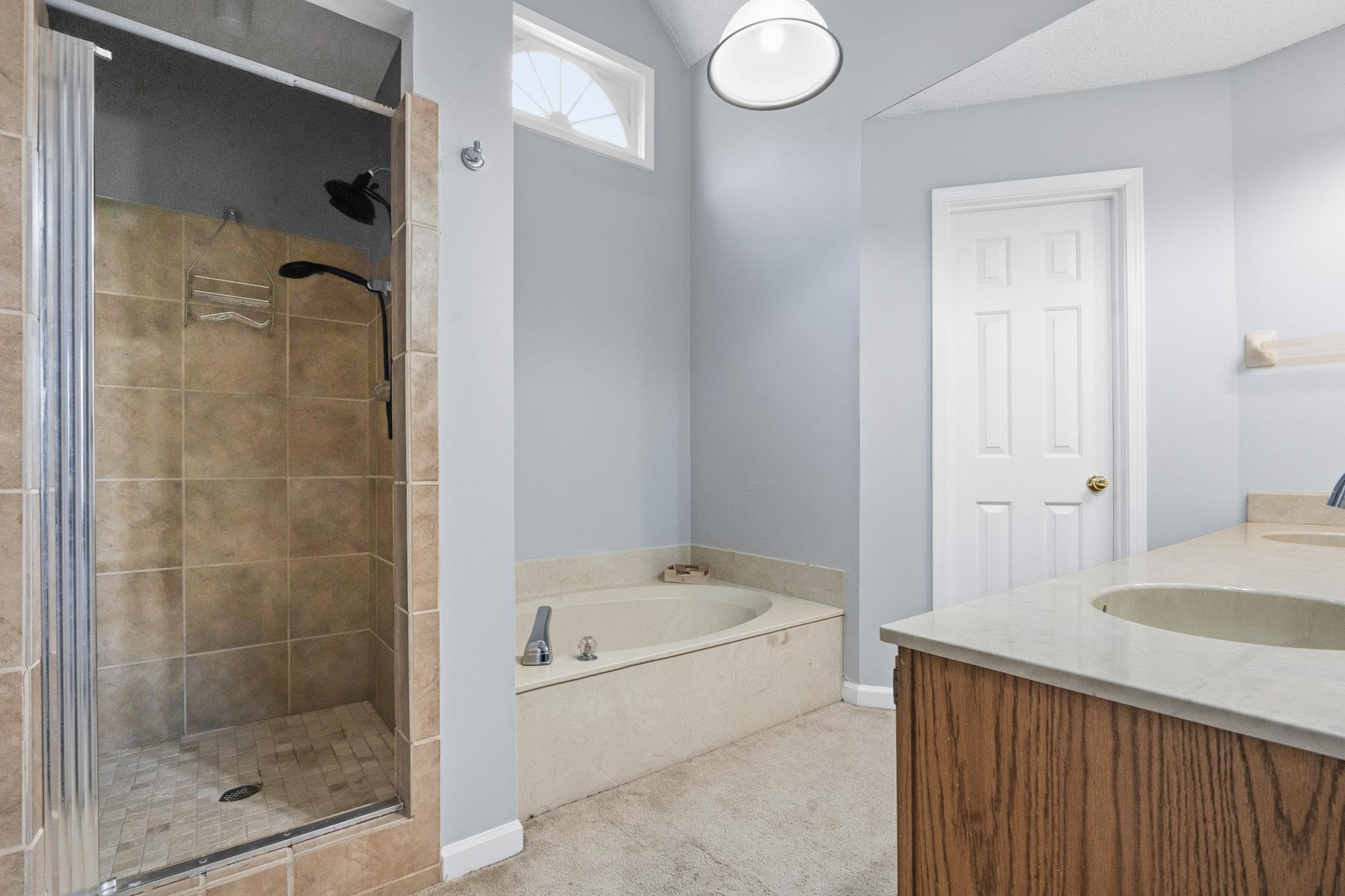 7105 Cutter Mill Road Memphis, TN 38141 - Photo 23 of 23 Full bathroom featuring a shower stall, double vanity, and a bath