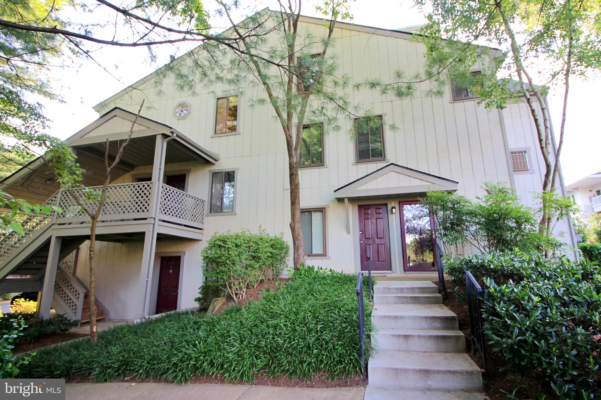 2233 Hunter's Run Drive Reston, VA 20191 - Photo 1 of 50 a front view of a house with a yard