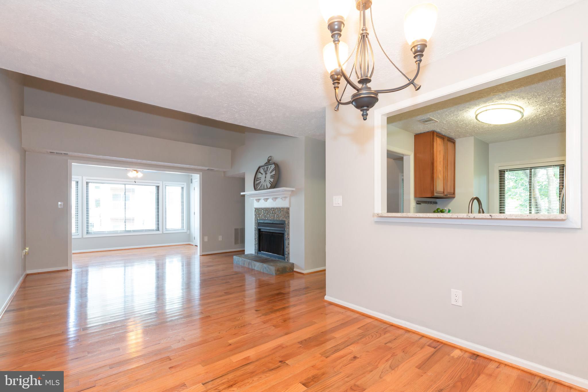 2233 Hunter's Run Drive Reston, VA 20191 - Photo 11 of 50 a view of empty room with wooden floor and fan
