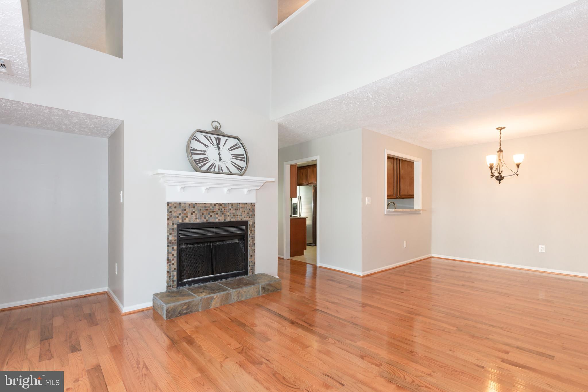 2233 Hunter's Run Drive Reston, VA 20191 - Photo 12 of 50 a view of a livingroom with a fireplace and wooden floor