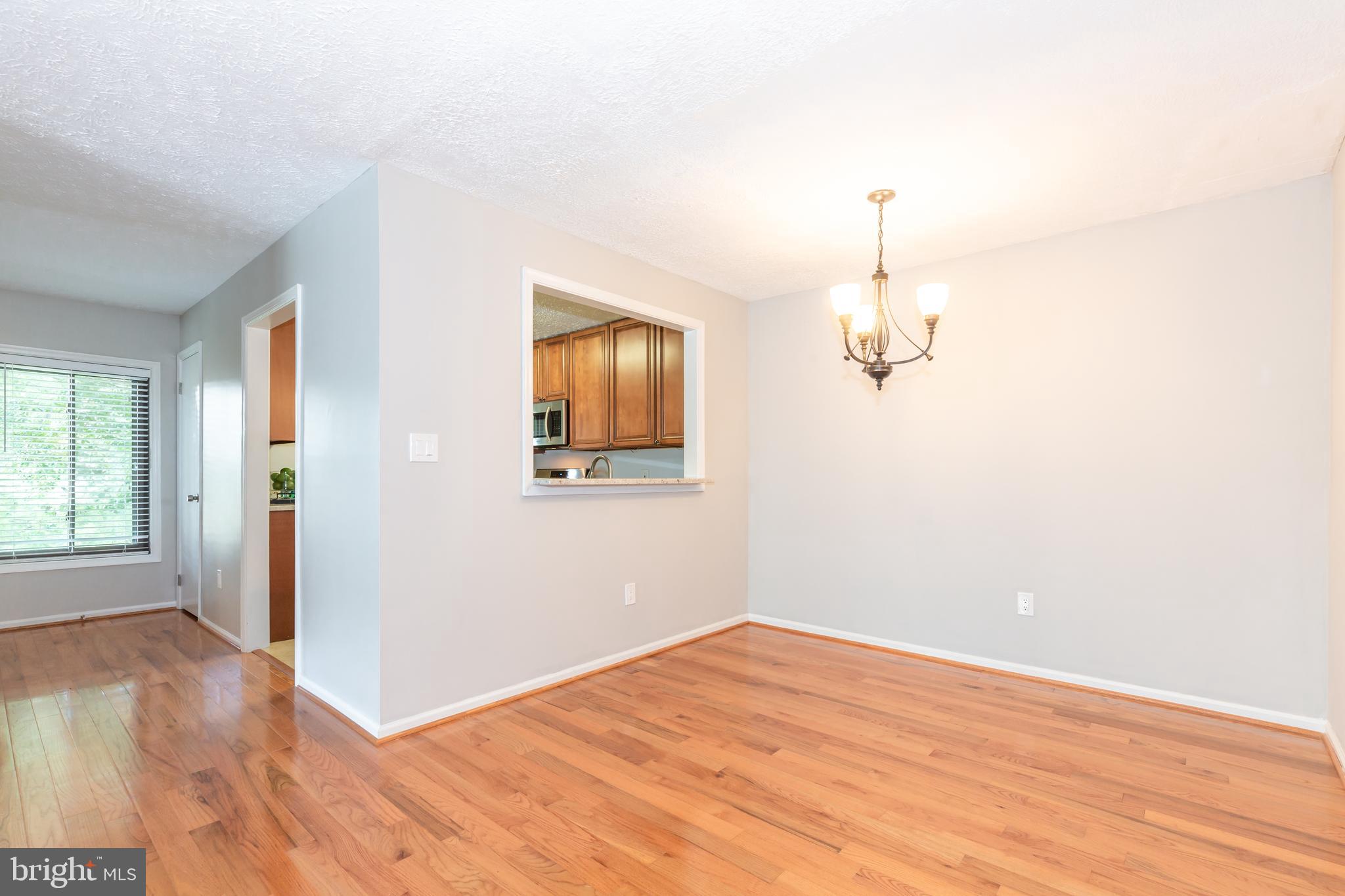2233 Hunter's Run Drive Reston, VA 20191 - Photo 14 of 50 a view of empty room with wooden floor and fan