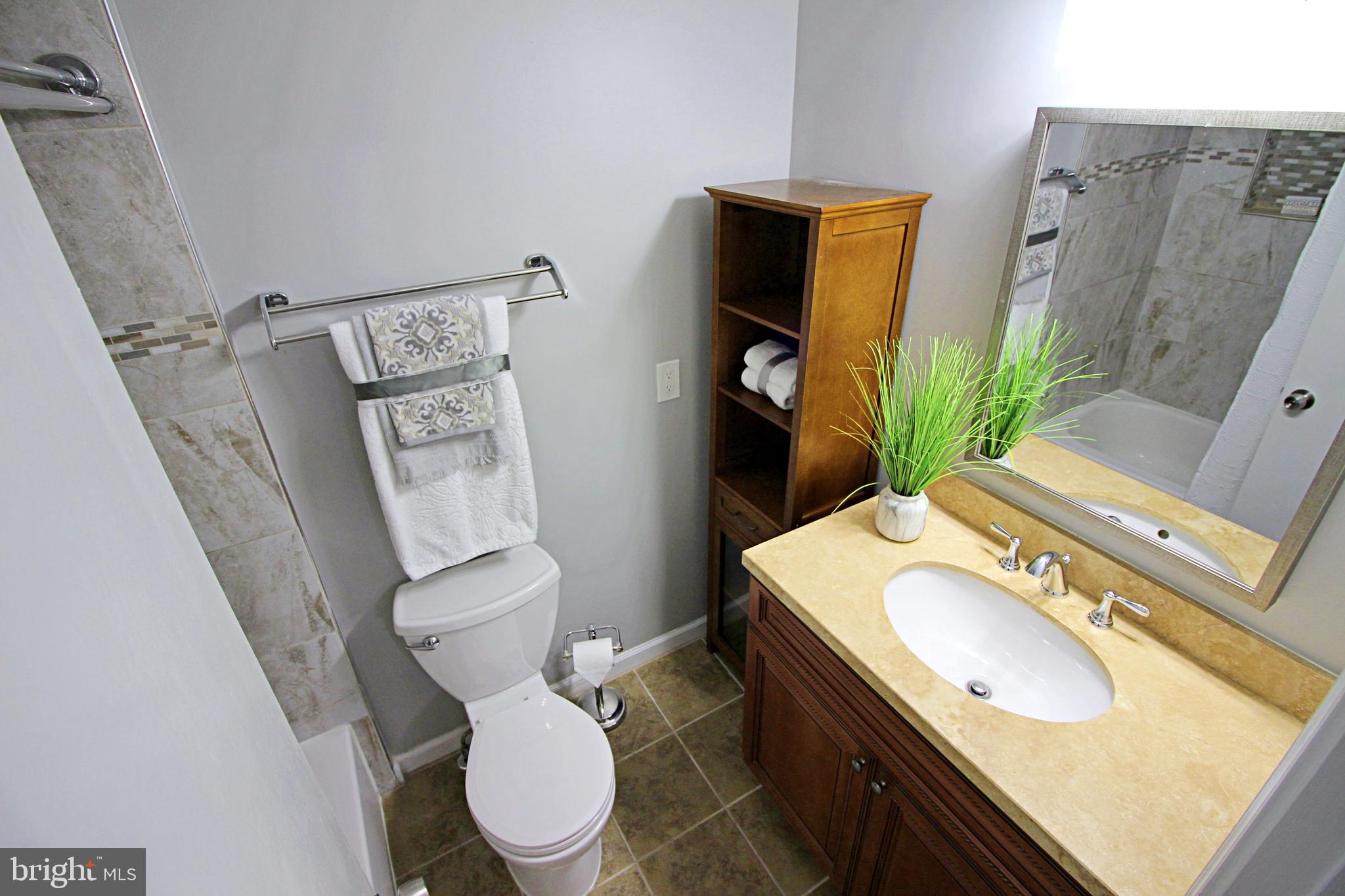 2233 Hunter's Run Drive Reston, VA 20191 - Photo 27 of 50 a bathroom with a sink toilet and mirror