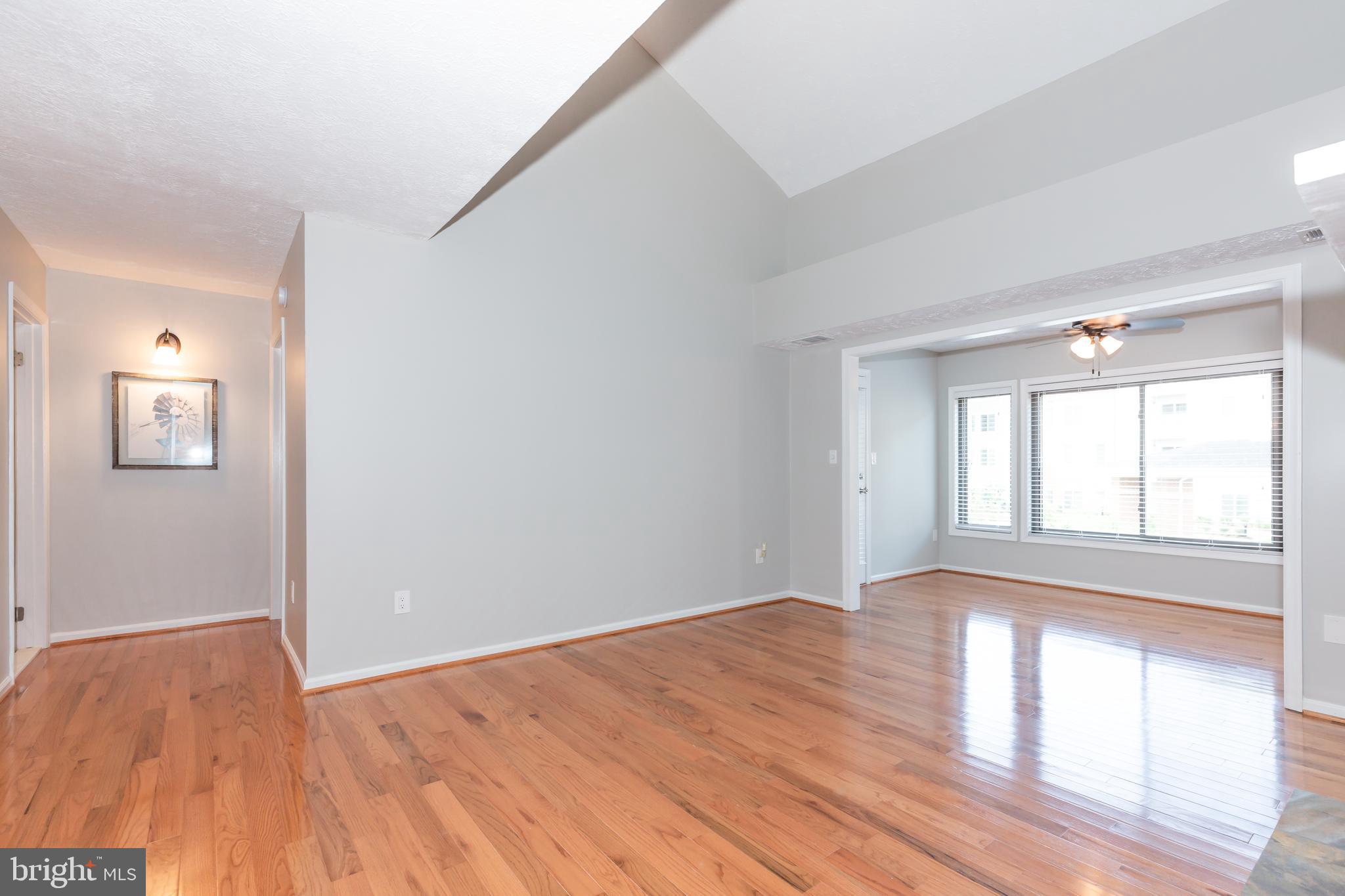 2233 Hunter's Run Drive Reston, VA 20191 - Photo 5 of 50 a view of empty room with wooden floor and fan