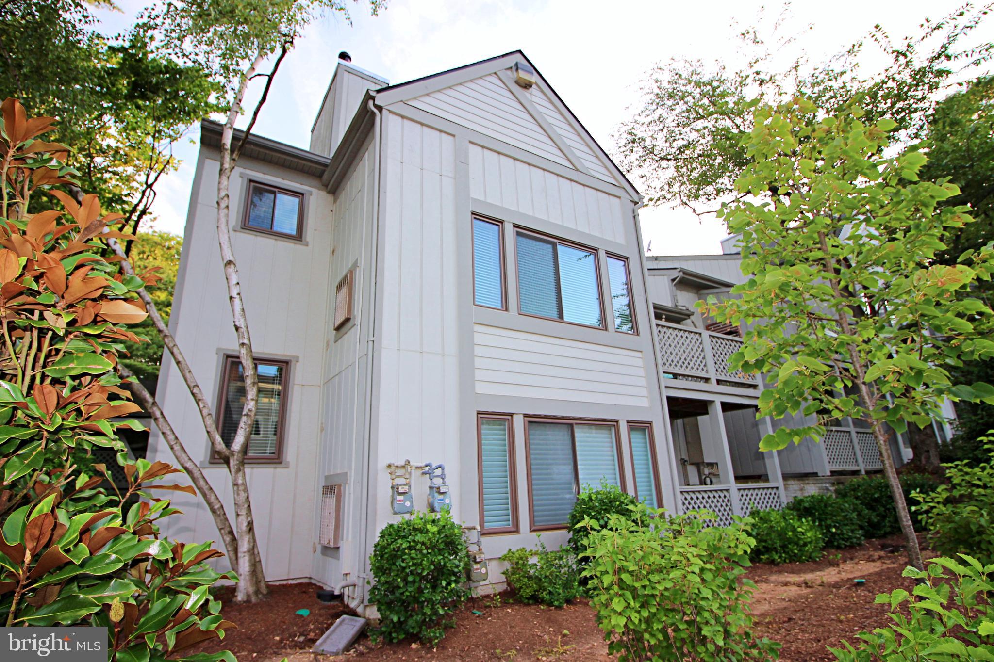2233 Hunter's Run Drive Reston, VA 20191 - Photo 43 of 50 a front view of a house with a garden
