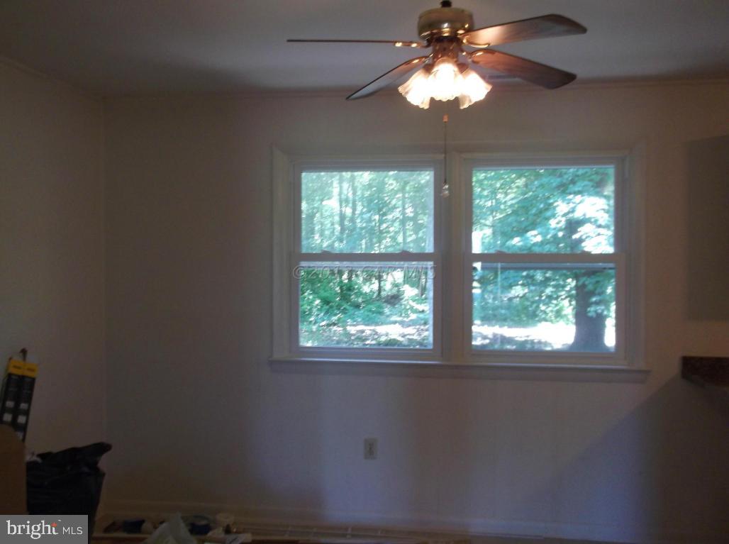 31245 Eden Allen Road Eden, MD 21822 - Photo 4 of 10 a lamp that has a large window in a room