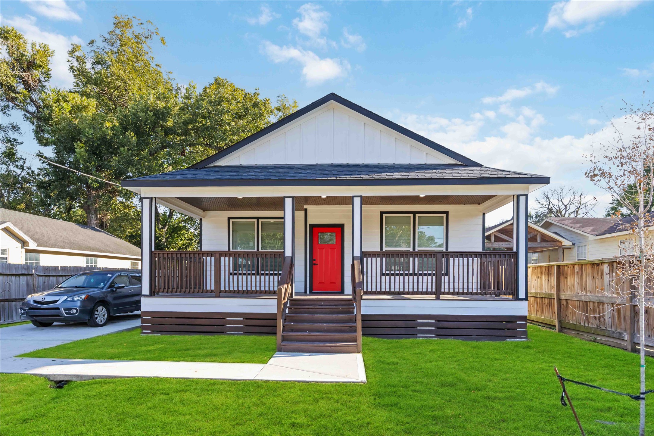 a front view of a house with a yard table and chairs