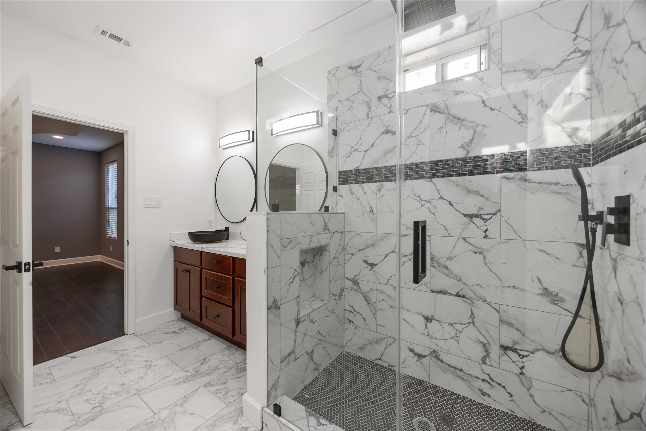 813 Fortune Street Houston, TX 77088 - Photo 21 of 27 a bathroom with a granite countertop shower a mirror and a sink